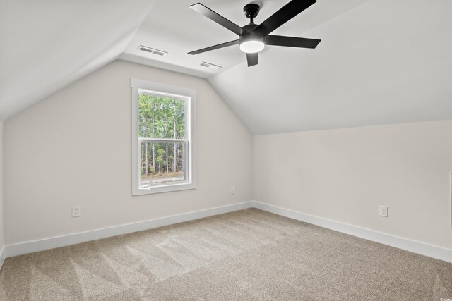 bonus room with ceiling fan, carpet, and vaulted ceiling