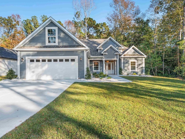 view of front facade with a front yard and a garage