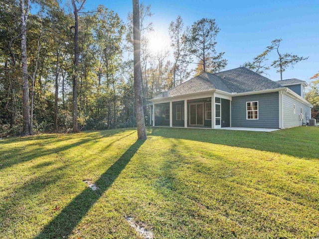 view of yard with a sunroom