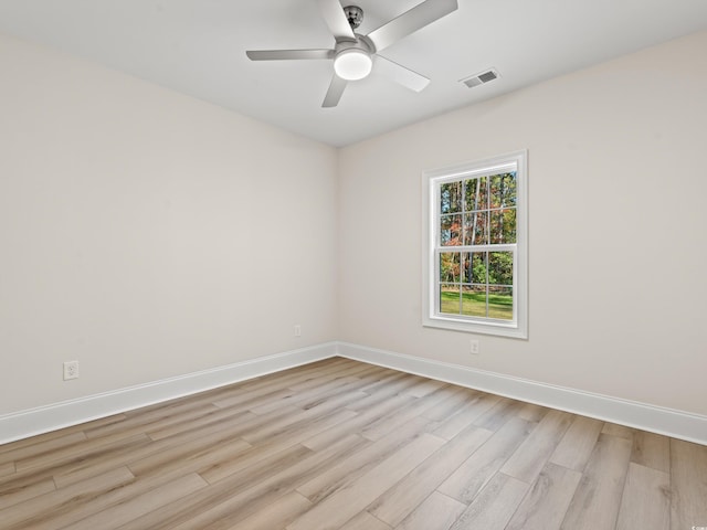 spare room featuring ceiling fan and light hardwood / wood-style flooring