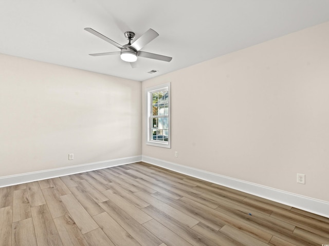 spare room with ceiling fan and light hardwood / wood-style floors