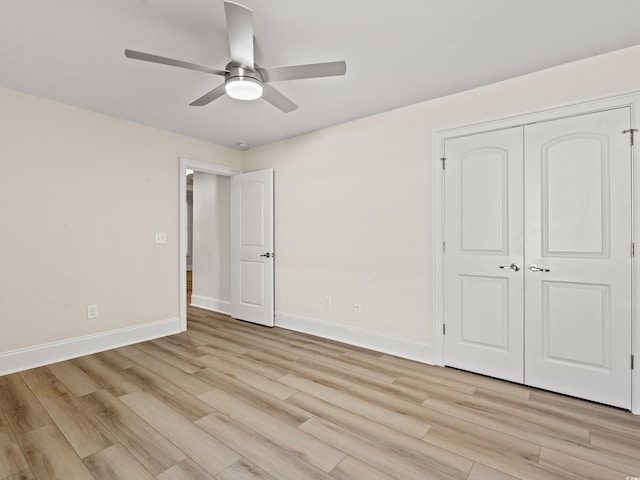 unfurnished bedroom with a closet, ceiling fan, and light hardwood / wood-style floors