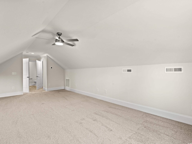 bonus room with ceiling fan, light colored carpet, and lofted ceiling