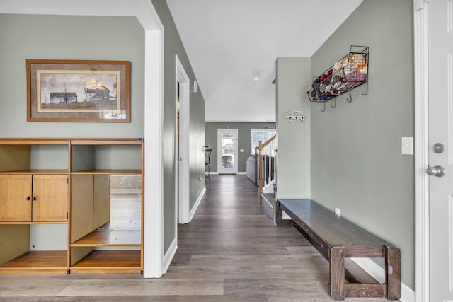 corridor with hardwood / wood-style flooring