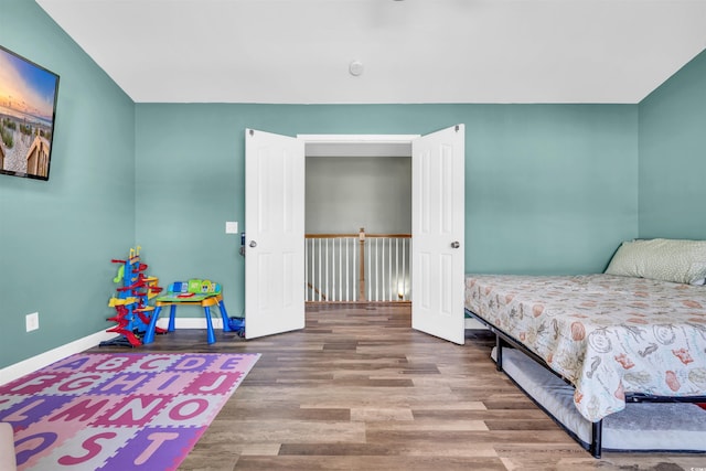 bedroom featuring hardwood / wood-style flooring