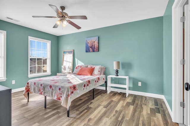 bedroom with ceiling fan and hardwood / wood-style floors