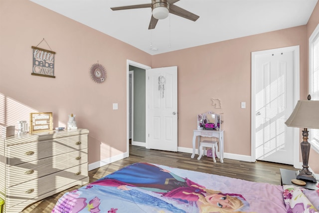 bedroom featuring ceiling fan and dark wood-type flooring