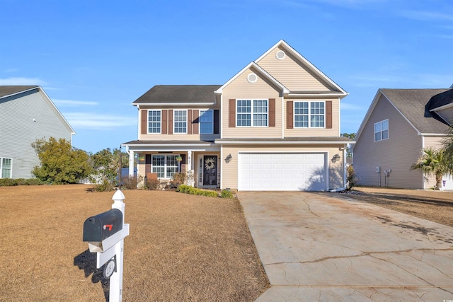 view of front of home with a front yard, a porch, and a garage