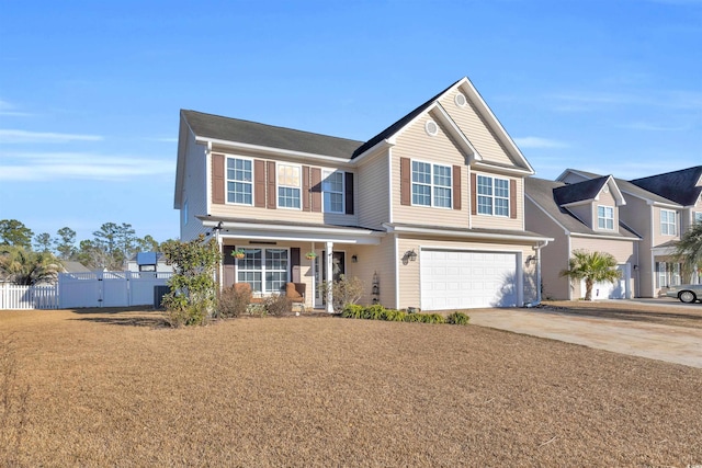 view of front of property with a front lawn and a garage