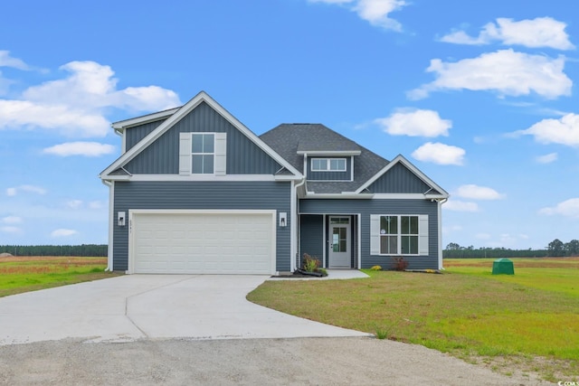 craftsman-style house featuring a garage and a front yard