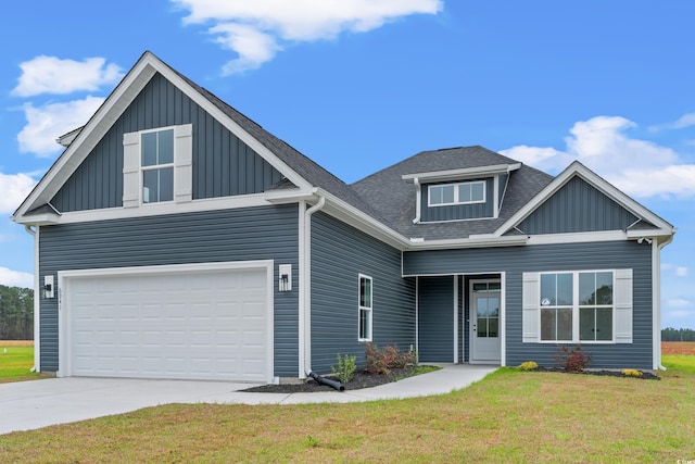 craftsman inspired home featuring a front yard and a garage