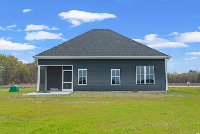 back of house featuring a yard