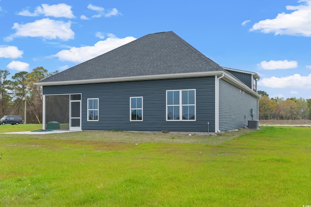 view of property exterior featuring a yard and central AC unit