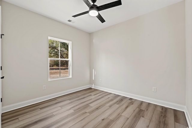 spare room with ceiling fan and light hardwood / wood-style floors