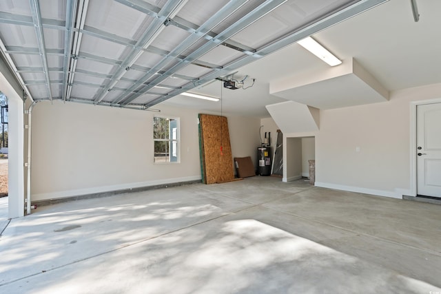 garage featuring a garage door opener and water heater