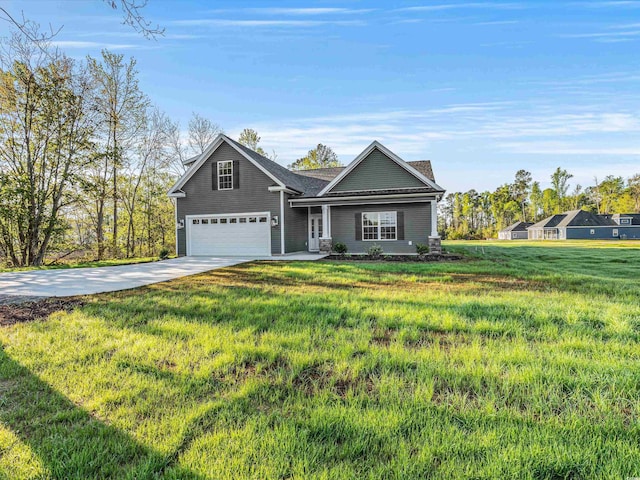 view of front of property featuring a garage and a front lawn