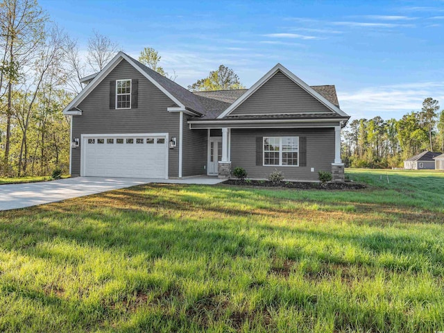 front of property with a garage and a front lawn