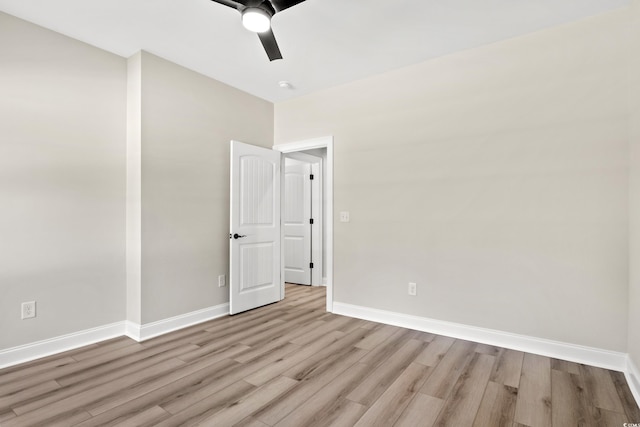 unfurnished room featuring light wood-type flooring and ceiling fan