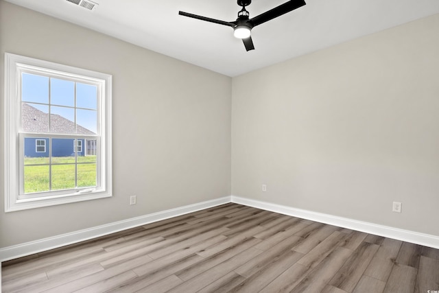 unfurnished room with ceiling fan and light wood-type flooring