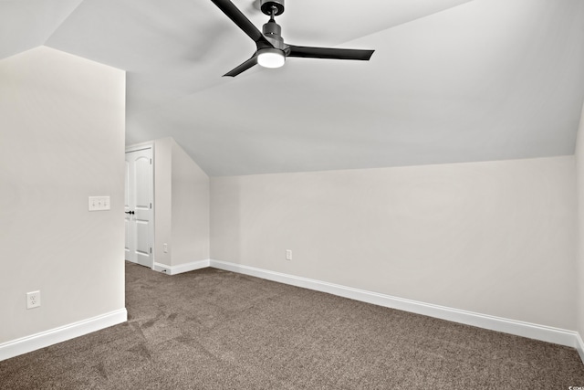 additional living space with ceiling fan, carpet, and lofted ceiling