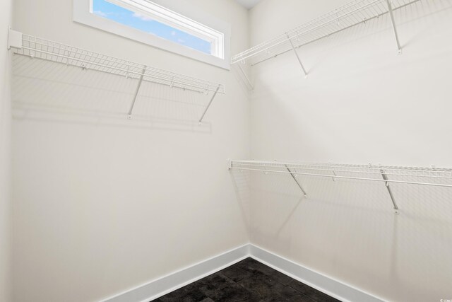 bathroom featuring tile patterned floors, vanity, a healthy amount of sunlight, and plus walk in shower