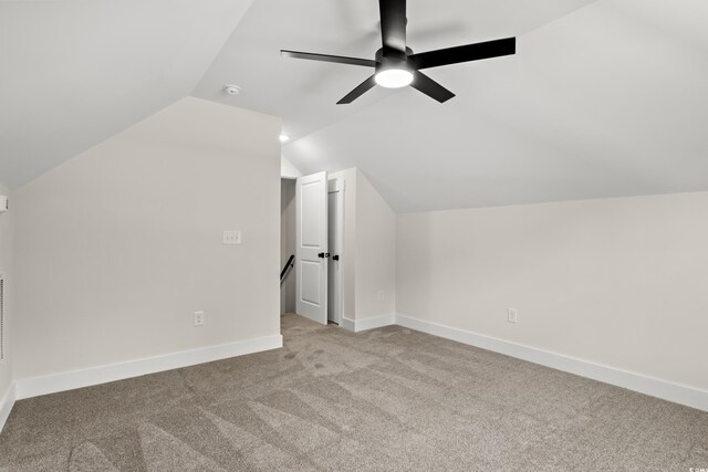 bathroom featuring hardwood / wood-style floors, toilet, lofted ceiling, and sink