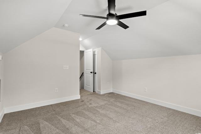 additional living space with ceiling fan, lofted ceiling, and light carpet