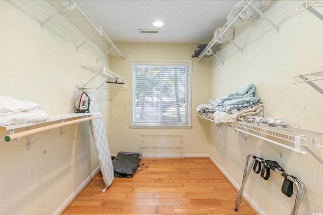 walk in closet featuring wood-type flooring