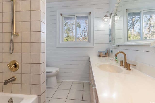 full bathroom featuring tile patterned floors, vanity, bathtub / shower combination, and toilet