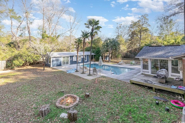 view of pool with an outbuilding and a deck