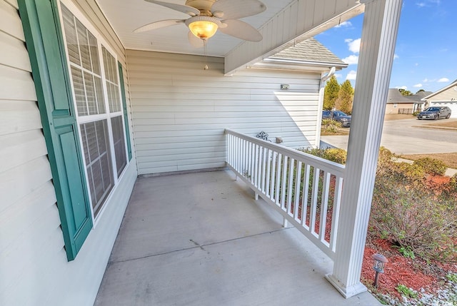 balcony featuring ceiling fan and a porch