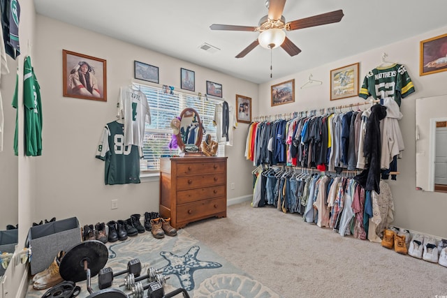 spacious closet featuring carpet floors and ceiling fan