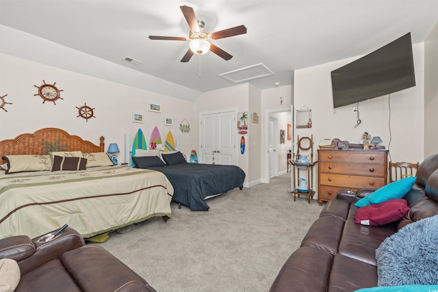 bedroom featuring ceiling fan, light colored carpet, and a closet