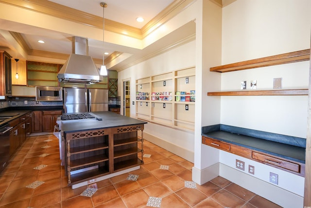 kitchen featuring crown molding, dark tile patterned flooring, island range hood, and appliances with stainless steel finishes