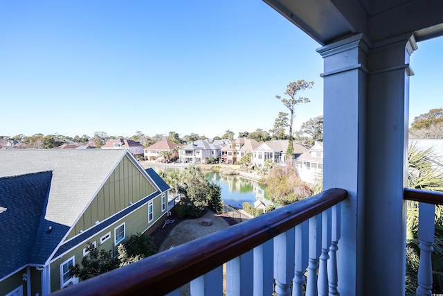 balcony featuring a water view