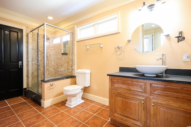 bathroom with an enclosed shower, vanity, crown molding, and tile patterned floors