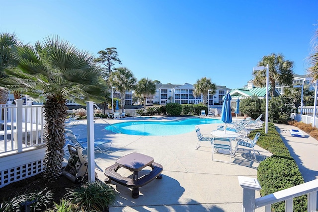 view of swimming pool featuring a patio area