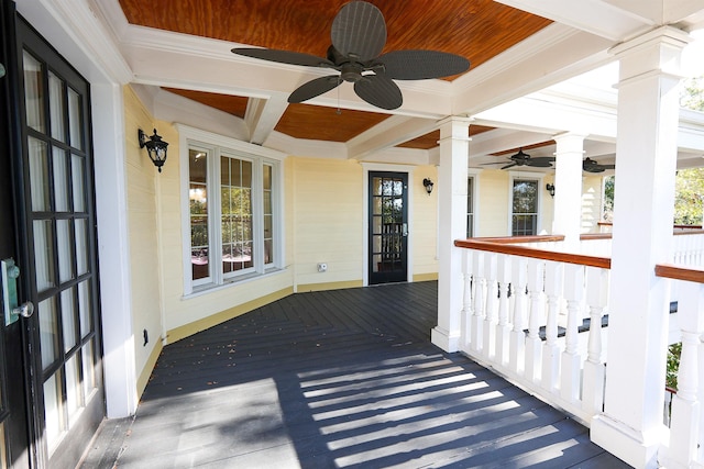 wooden deck featuring ceiling fan