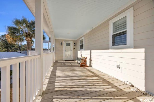 entrance to property featuring a porch