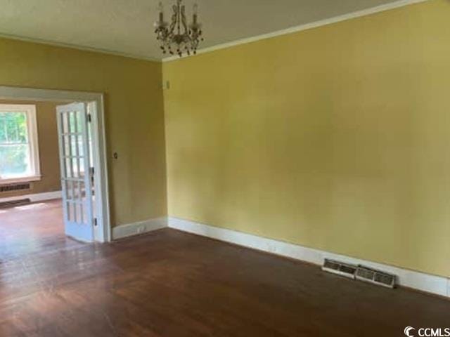116 Singletary Ave, Lake City, SC 29560 - spare room with baseboards, a chandelier, and crown molding