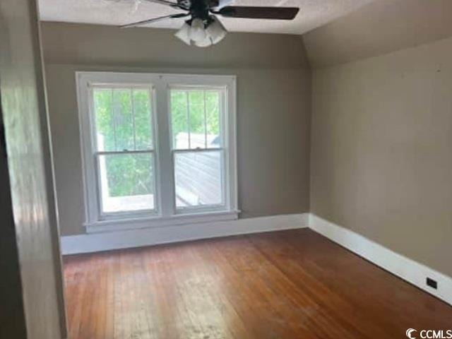 116 Singletary Ave, Lake City, SC 29560 - unfurnished room with ceiling fan, healthy amount of natural light, wood finished floors, baseboards, and vaulted ceiling