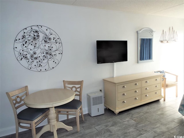 1207 S Ocean Blvd Unit 20207, Myrtle Beach, SC 29577 - dining space featuring baseboards and wood finished floors