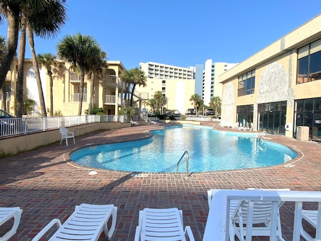 view of swimming pool with a patio