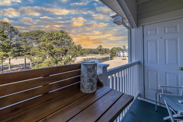 view of balcony at dusk