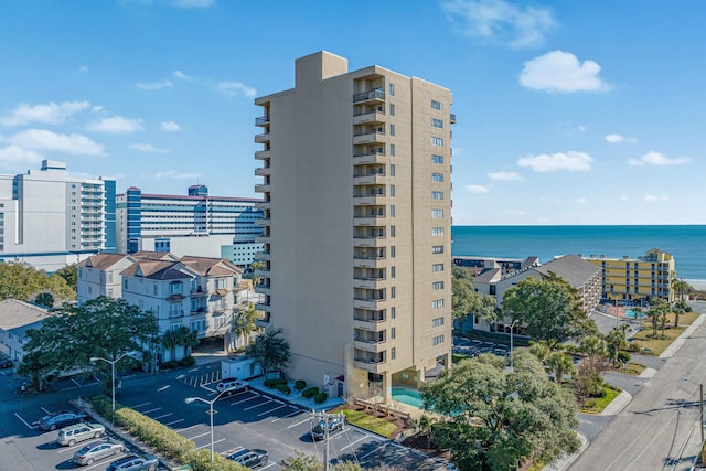 view of building exterior with a water view