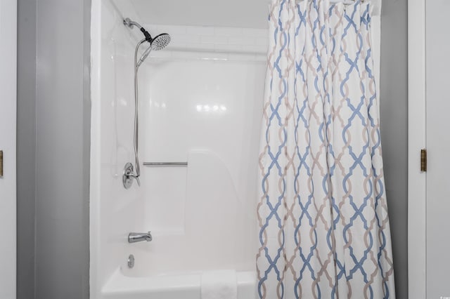 bathroom featuring shower / bathtub combination with curtain