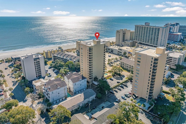 bird's eye view with a water view and a view of the beach