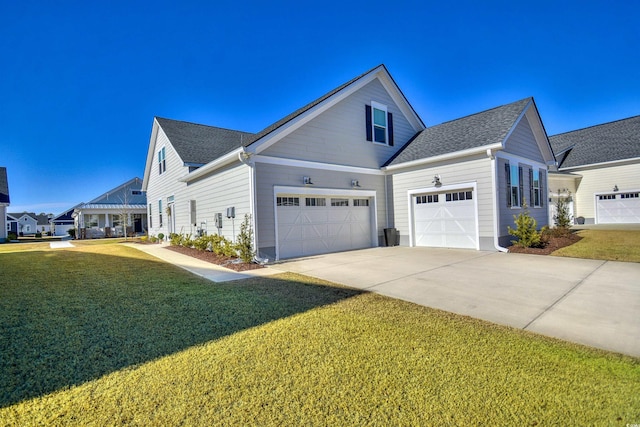 view of home's exterior featuring a yard and a garage