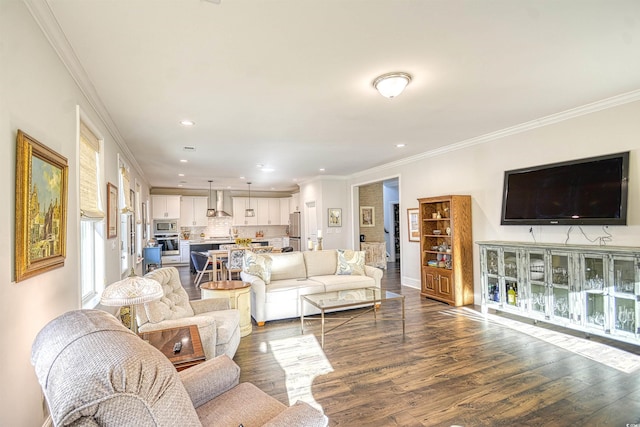 living room with crown molding and hardwood / wood-style floors