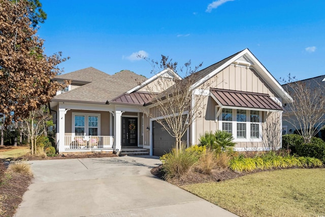 view of front of home with a porch and a garage